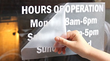 White vinyl cut window lettering