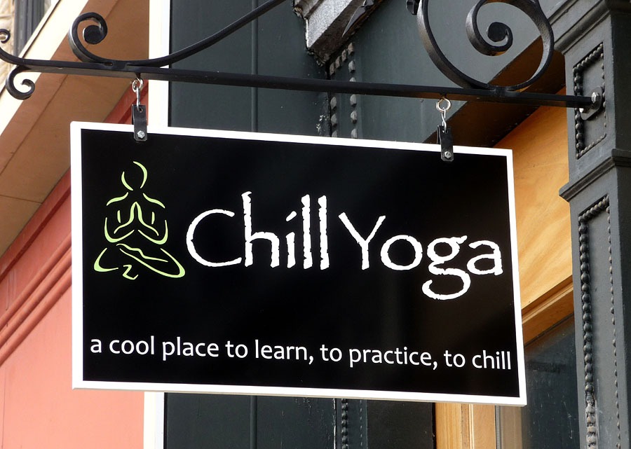 Layered vinyl decals on sign board